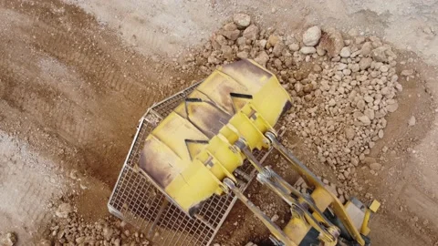 Top view of a heavy wheel loader performing material screening in a quarry Stock Footage 163375325