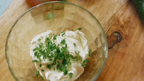 Top view of herb cream cheese in a patterned bowl, 4K Stock Footage 341120131