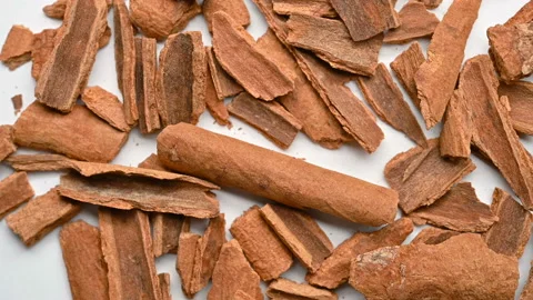 Top view herb RouGui or Cinnamomi Cortex or powdered Cassia Bark powder rotat Stock Footage 147437947