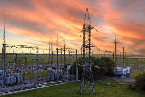 Top view of a high voltage distribution substation during sunset. Stock Photos