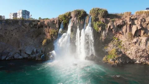 Top view of a high waterfall falling into the mediterranean sea. Clean ecology Stock-Footage 142819313