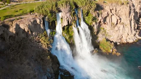 Top view of a high waterfall falling into the mediterranean sea. Clean ecology Stock-Footage 142819618