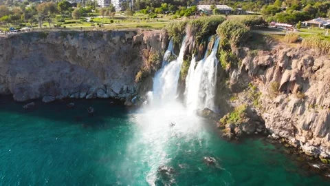 Top view of a high waterfall falling into the mediterranean sea. Clean ecology Stock-Footage 142819669