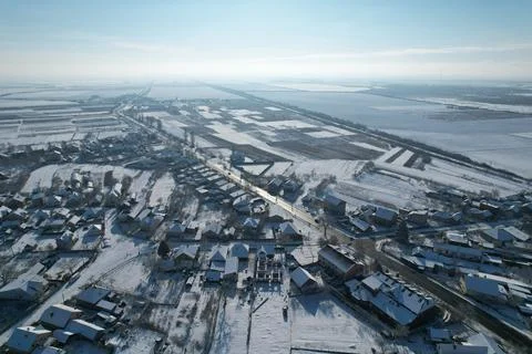 Top view of the highway and the parallel railroad. Snow-covered fields and Stock Photos