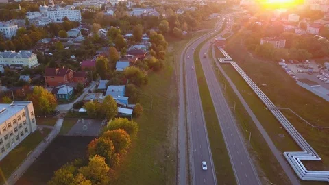 Top view of the highway in small town at sunset Video stock 99073299