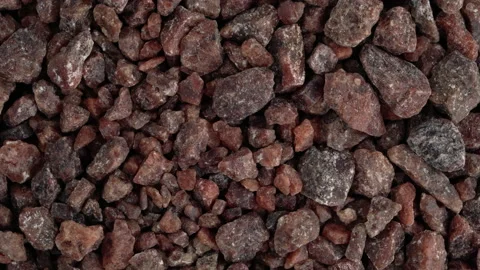 Top view of Himalayan black salt rocks rotating. Kala namak salt. Closeup. Stock Footage 170666846