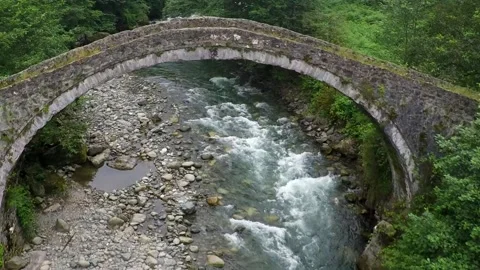 Top view of the historical stone bridge and the creek flowing under it Stock Footage 148877928