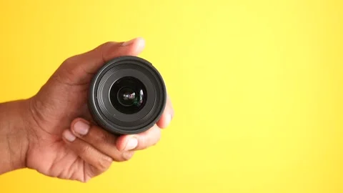 Top view of holding a camera lenses Stock Footage 241636755