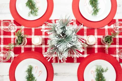 Top view of holiday dinner table decorated in red and white Stock Photos