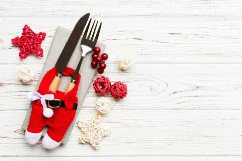 Top view of holiday set of fork and knife on wooden background. Christmas d.. Stock Photos