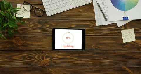 Top view on the horizontal black tablet computer with white screen on which Stock Footage 95099574