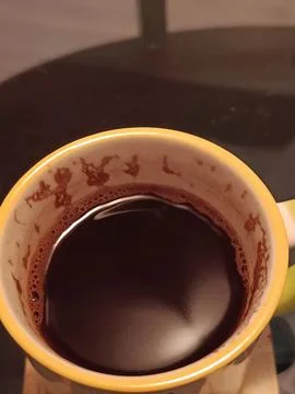 Top View of Hot Dark Coffee in Yellow Ceramic Mug Stock Photos