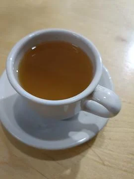 Top view of hot tea with ginger and lemon in the cup Stock Photos