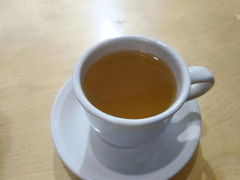 Top view of hot tea with ginger and lemon in the cup Stock Photos