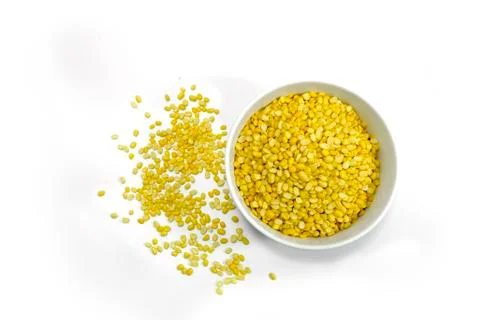 Top view of Hulled split mung bean in White cup on white background Stock Photos