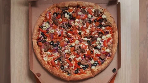 Top view of human hands taking pizza slices with from the delivery box Stock Footage 124607073