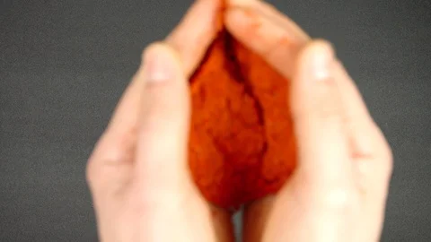 TOP VIEW: Human hands throw a red pepper powder on a black table - Slow Motion Vídeo Stock 90240154