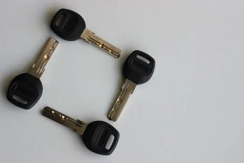 Top View Of Identical Lock Keys In A Square Shape Isolated On White Stock Photos