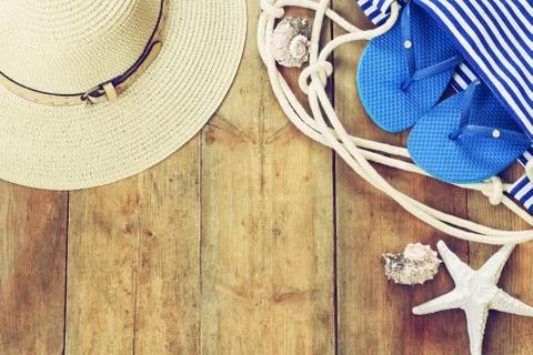 Top view image of beach accessories on wooden deck Stock Photos
