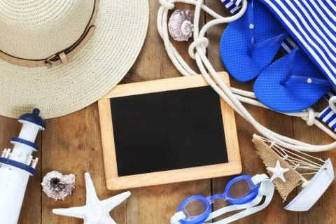 Top view image of beach accessories and blank blackboard Stock Photos