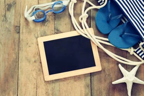 Top view image of beach accessories and blank blackboard Stock Photos