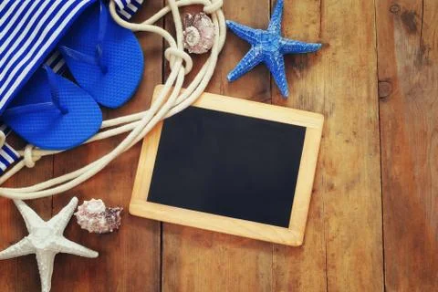 Top view image of beach accessories and blank blackboard Stock Photos