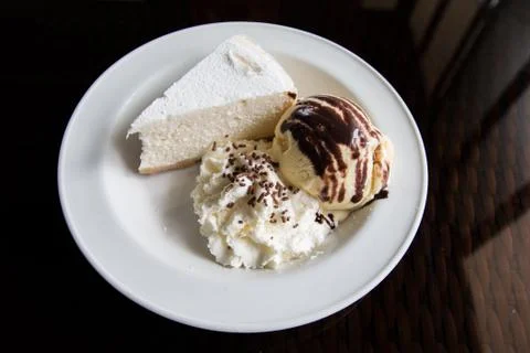 Top view image of cheese cake, ice cream, and whipped cream. Stock Photos