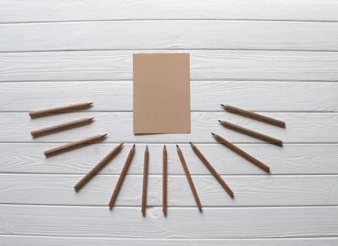 Top view image of notebook with pencils on wooden white table. Business, Educ Foto stock