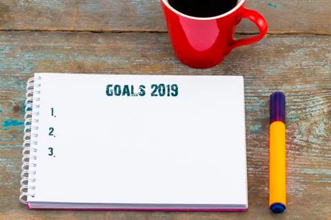 Top view image of open notebook with blank pages next to cup of coffee on woo Stock Photos