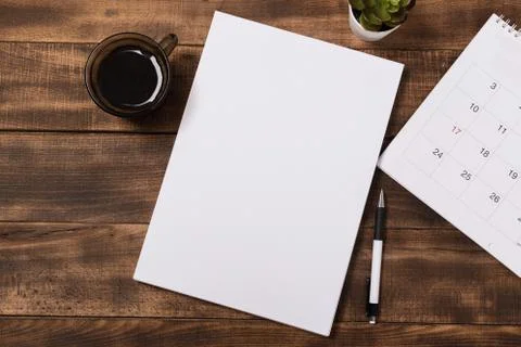 Top view image of open notebook with blank pages next to cup of coffee on woo Stock Photos