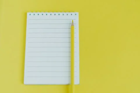 Top view image of an open notebook with blank pages. school notebook on yello Stock Photos