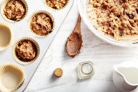 Top view image showing making of delicious fruit and nut cupcake on white mar Stock Photos