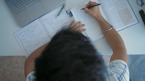 Top View, Indian Student Preparing for Exams While Sitting At The Table Stock Footage 107990627