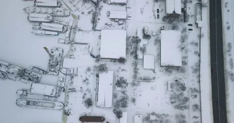 Top view of the industrial area with a dock with a barge and a tap of frozen Stock Footage 148322680