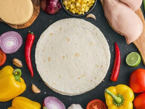 Top view of ingridients for preparing the Mexican chicken quesadilla on the b Stock Photos
