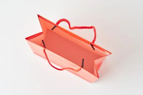 Top view inside open red paper shopping bag on white background. Stock Photos