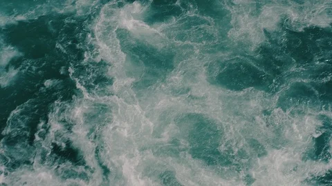 Top view of intense water flow in the river near the waterfall Video stock 111068506