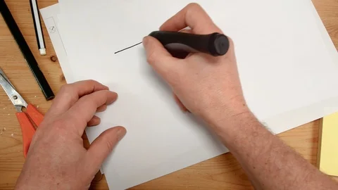 Top view, an interior designer's hand draws an ideal map for a new home, footage Stock Footage 104098909