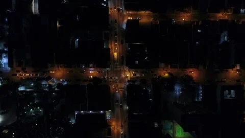 Top View of Intersection, Rooftops and illuminated streets Stock Footage 77135111
