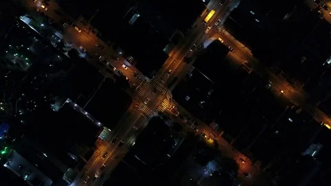 Top View of Intersection, Rooftops and illuminated streets Stock Footage 77135192