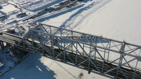 The top view on the iron bridge in the winter through the frozen river. Stock Footage 164546474