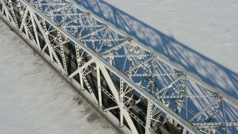 The top view on the iron bridge in the winter through the frozen river. Stock Footage 164546609