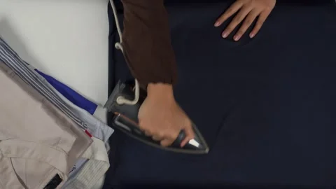 Top view of ironing clothes Stock Footage 276398436