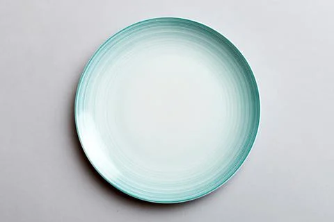 Top view of isolated of colored background empty round blue plate for food... Stock Photos