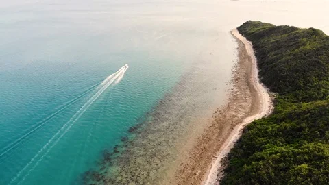 Top view of an isolated motorboat in the open sea as it runs Stock Footage 103431336
