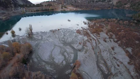 Top view of the Issyk mountain lake and the dam. Stock Footage 232287797