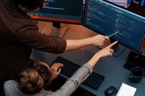 Top view IT developers discussing with point website coding system. Infobahn. Stock Photos