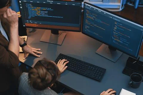 Top view IT developers discussing with point website coding system. Infobahn. 库存照片