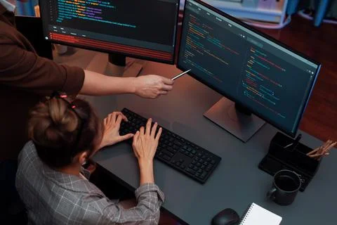 Top view IT developers discussing with point website coding system. Infobahn. Stock Photos