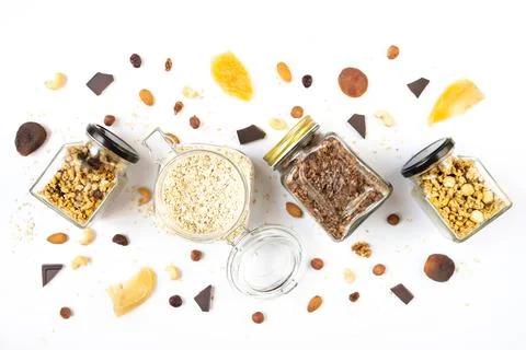 Top view of jars full of oats and various crunchy granola Stock Photos